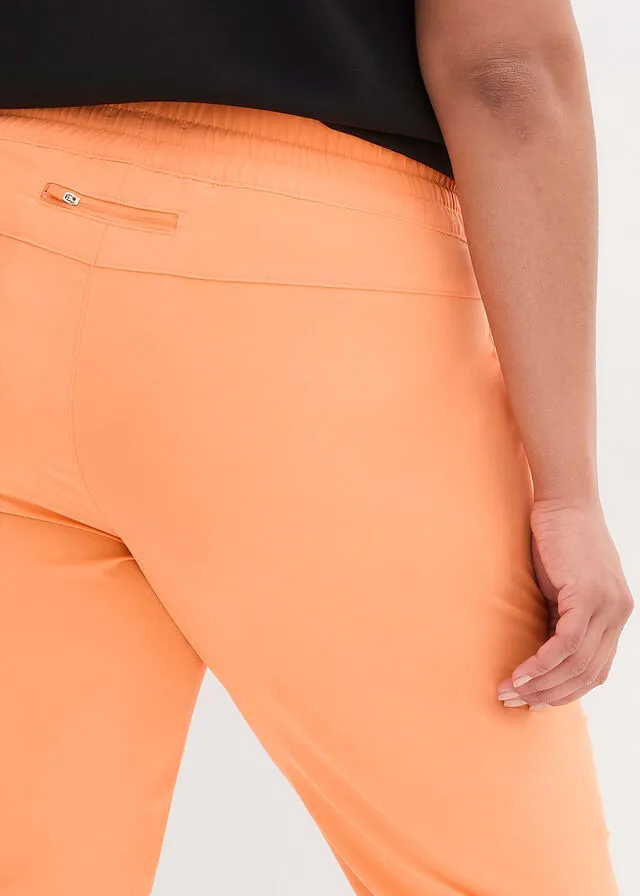 Pantalón funcional de largo capri y secado rápido Naranja claro